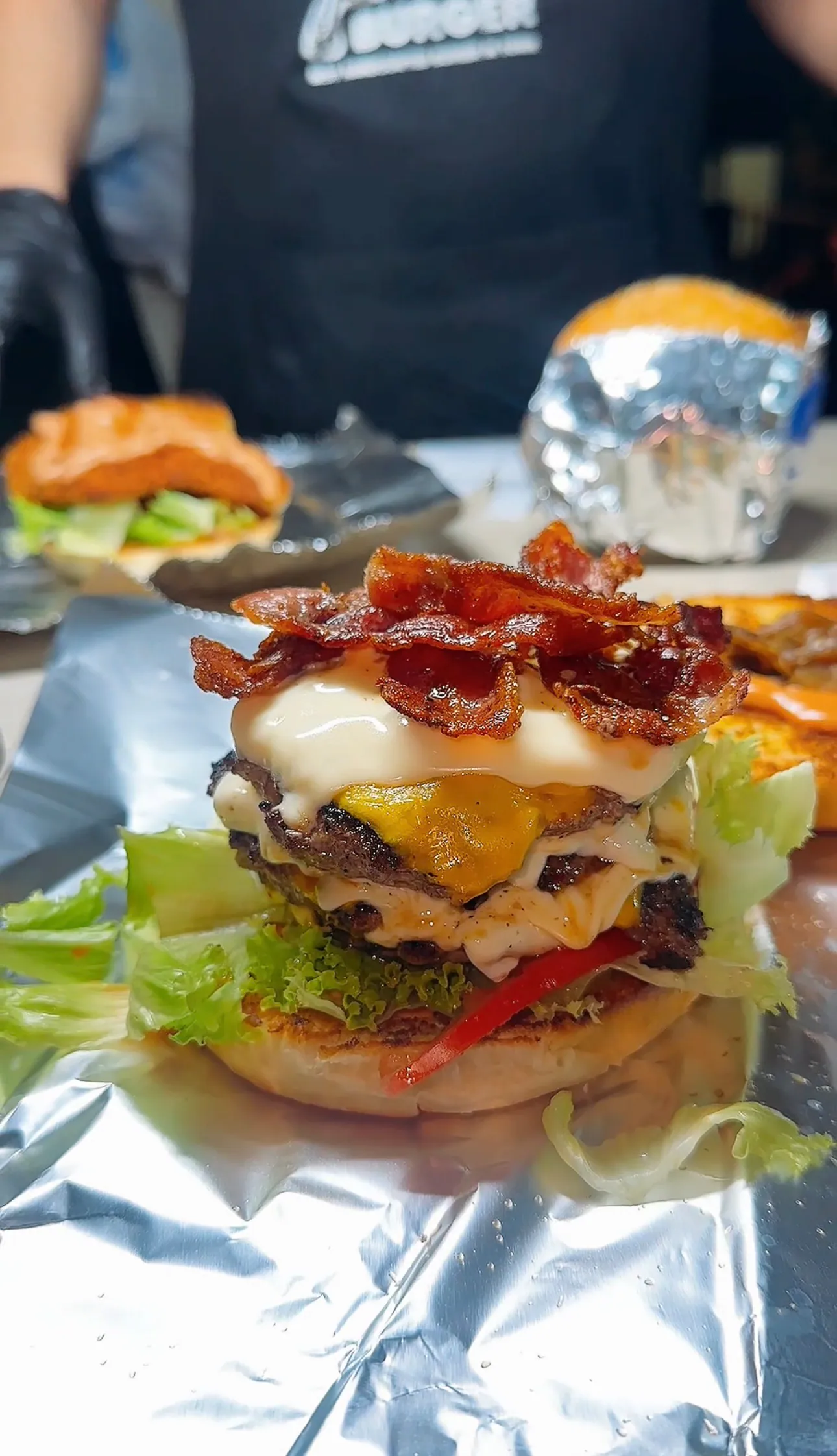 Stacked burger with bacon and a fried egg